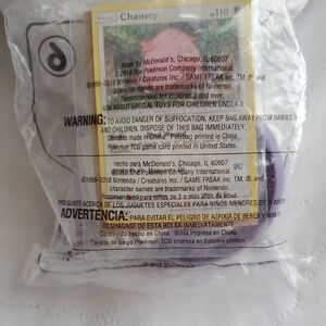 McDonald's Pokémon Chansey Card / Tornadus Toy